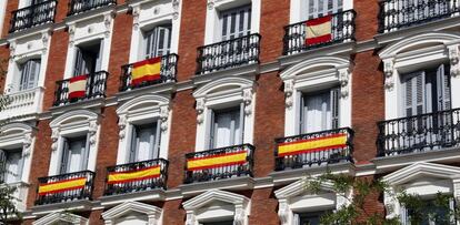 Spanish flags on display on Madrid buildings.