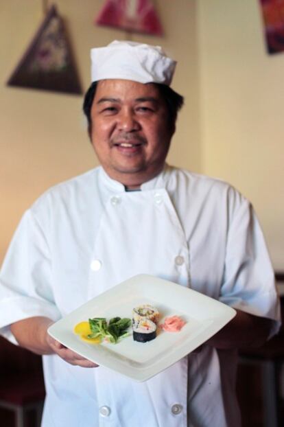 Cenon Gawaran with a plate of his maki tapa.