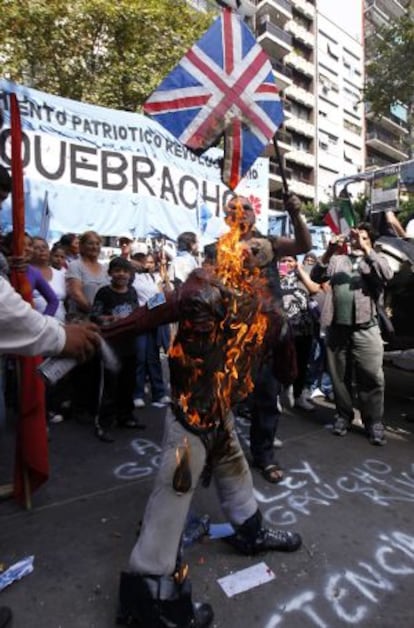 Protestors burn an effigy of Prince William outside the British Embassy.