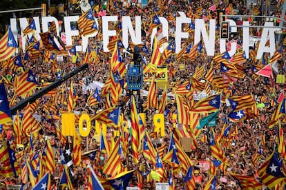 People wave pro-independence flags at the march for the Diada, or National Day of Catalonia, in 2018.