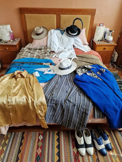 A few of the more than 80 outfits José de la Rosa keeps in the private Pachuco chapel that is his dressing room.