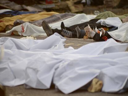 CHIAPAS, MEXICO - DECEMBER 09: (EDITORS NOTE: Image depicts graphic content) Mexican national guard officers work in the area after a truck accident in Tuxtla Gutierrez, Mexico on December 09, 2021. At least 54 migrants were killed and 59 others were injured when the cargo truck they were traveling in crashed into a bridge in southern Mexico. Majority of deceased of Honduran nationality; injured rushed to nearby hospitals. (Photo by Stringer/Anadolu Agency via Getty Images)