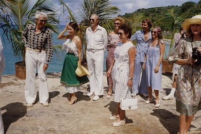 Princess Margaret and a group of her friends welcome Queen Elizabeth II on her visit to the island.