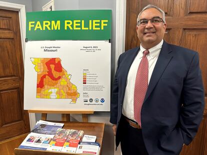 Missouri Treasurer Vivek Malek stands near a poster promoting drought conditions and state aid programs on Jan. 4, 2024, at his Capitol office in Jefferson City, Mo.