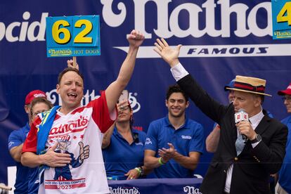 Joey Chestnut celebrates after winning his 16th championship title during the 2023 Nathan's Famous Fourth of July hot dog eating contest in the Coney Island section of the Brooklyn borough of New York, Tuesday, July. 4, 2023.