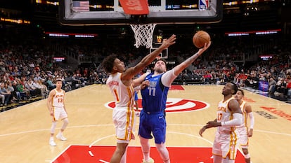 Luka Doncic goes for the basket in a game where he scored 73 points.