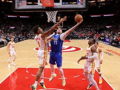 Luka Doncic goes for the basket in a game where he scored 73 points.