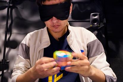 University of Michigan student Stanley Chapel solves a Rubik's Cube while blindfolded, Wednesday, Nov. 23, 2022, in Ann Arbor, Mich.