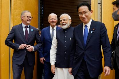 From left, Australian Prime Minister Anthony Albanese, U.S. President Joe Biden and Indian Prime Minister Narendra Modi are greeted by Japanese Prime Minister Fumio Kishida, right, during their arrival to the Quad leaders summit at Kantei Palace, May 24, 2022, in Tokyo.