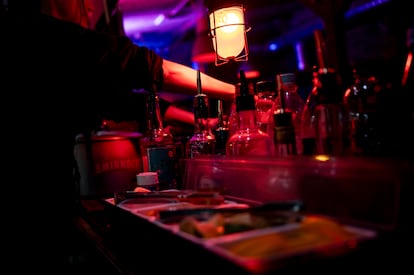 A bartender serves a drink at the Re:mise club in Berlin.
