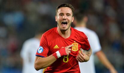 Saúl celebrates one of his three goals against Italy.