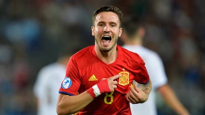 Saúl celebrates one of his three goals against Italy.