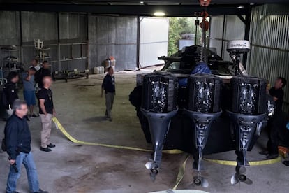 A speedboat with three outboard motors found inside a warehouse.