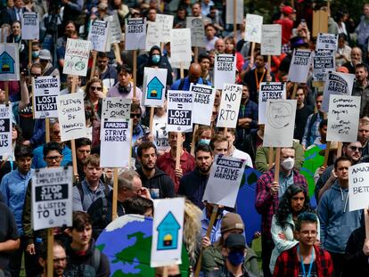 Amazon corporate workers hold picket signs while participating in a walkout to protest the company's return-to-office policies, Wednesday, May 31, 2023, in Seattle.