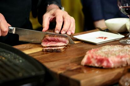 Wolfgang Puck presents one of the cuts of meat that will be served at the Governors Ball, the Academy Awards after party.