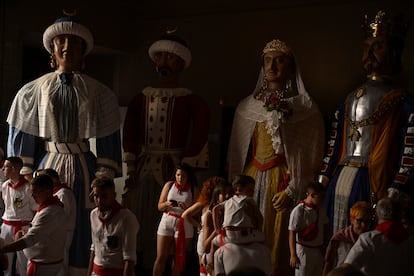 Participants in the parade of "Gigantes and Cabezudos" (Giants and Big Heads) take a break during the San Fermin fiestas in Pamplona, on  July 7, 2023. 