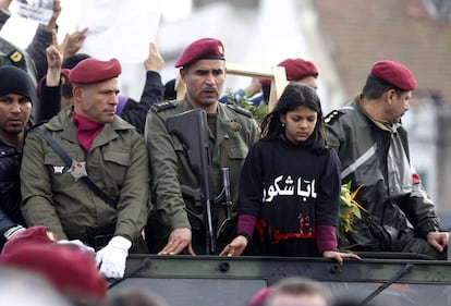 The daughter of assassinated prominent Tunisian opposition politician Chokri Belaid is seen during his funeral procession in the Jebel Jelloud district in Tunis February 8, 2013. Tens of thousands of mourners chanted anti-Islamist slogans on Friday at the Tunis funeral of secular opposition leader Belaid, whose assassination has plunged Tunisia deeper into political crisis. REUTERS/Louafi Larbi (TUNISIA - Tags: CIVIL UNREST CRIME LAW POLITICS)