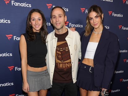 Michael Rubin, between his daughter Kylie Rubin (left) and his partner Camille Fishel, at a Super Bowl party organized by his company Fanatics at the Marquee club at The Cosmopolitan hotel in Las Vegas on February 10, 2024.