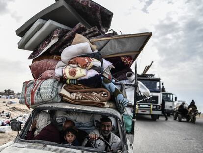 Palestinians travel to the middle parts of Gaza after attacks on Rafah intensify in Gaza on February 13, 2024.