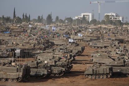 Armored vehicles gather near the border with Gaza, at an unspecified site in southern Israel, this Thursday.
