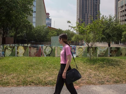 A woman walking by a square devoted to missing persons in downtown Monterrey, in the state of Nuevo León.