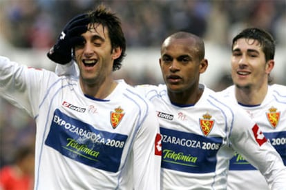 Milito, Ewerthon y Rubén García festejan uno de los goles al Mallorca.