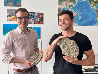 Geochemist Alfredo Martínez García and his colleague Jonathan Jung hold Paleozoic corals at the Max Planck Institute for Chemistry in Mainz, Germany.