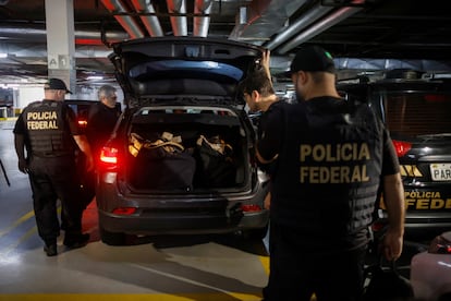 Federal Police officers leave the Liberal Party’s headquarters after a search in Brasilia, Brazil, on Thursday. 
