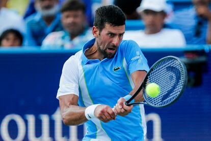 Novak Djokovic returns a shot against Carlos Alcaraz during the men's singles final of the Western and Southern Open tennis tournament at Lindner Family Tennis Center.