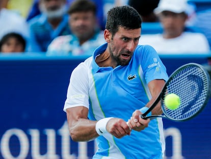 Novak Djokovic returns a shot against Carlos Alcaraz during the men's singles final of the Western and Southern Open tennis tournament at Lindner Family Tennis Center.