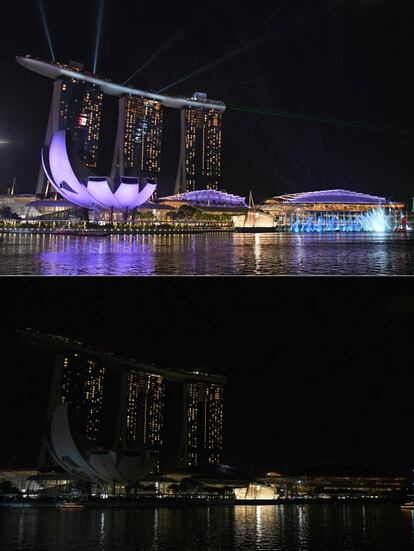 Vista general del hotel y complejo Marina Bay Sands, iluminado y con las luces apagadas, durante la campaña medioambiental de la Hora del Planeta en Singapur.