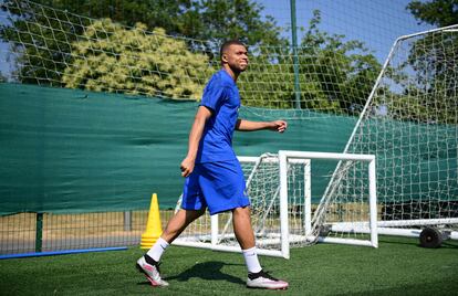 France's forward Kylian Mbappe arrives for a training session in Clairefontaine-en-Yvelines