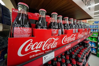 Bottles of Coca-Cola are on display at a grocery market in Uniontown, Pa, on Sunday, April 24, 2022.