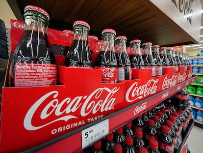 Bottles of Coca-Cola are on display at a grocery market in Uniontown, Pa, on Sunday, April 24, 2022.