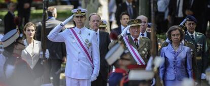 The incoming (left) and outgoing royals at a military parade this weekend.