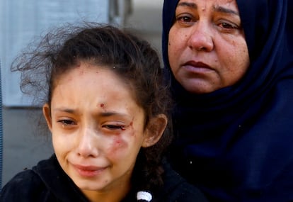 People react in the aftermath of a strike amid the conflict with Israel in Khan Younis, in the southern Gaza Strip, October 12, 2023. 