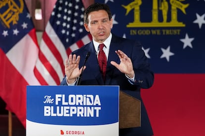 Florida Gov. Ron DeSantis speaks to a crowd at Adventure Outdoors gun store, Thursday, March 30, 2023