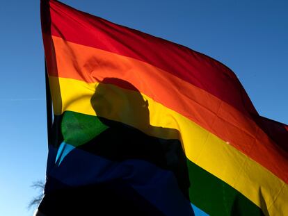 A person pays respects to the victims of the mass shooting at Club Q, an LGBTQ nightclub, in Colorado Springs, Colorado on November 20, 2022.