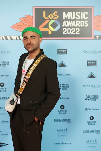 El cantante Nil Moliner ha sido uno de los primeros en llegar a la alfombra roja de LOS40 MusicAwards: “Tengo el fin de gira en diciembre y en 2023 pararé de tocar, pero aun así van a pasar muchas cosas. 2024 llegará más fuerte y con muchísima música nueva”, ha explicado a EL PAÍS a su entrada en el WiZink Center.
