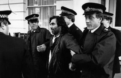 George Best being arrested for assaulting a police officer. 