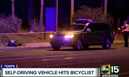 In this image taken from video provided by ABC-15, an investigator works at the scene of a fatal accident involving a self driving Uber car in Tempe, Ariz., March 19, 2018.