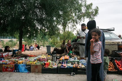 A Palestinian refugee sells food outside a UNRWA school-turned-shelter in Wadi El Zayni, Lebanon, on October 6.