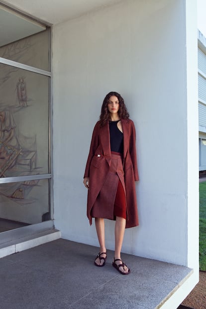 Wool and mohair coat with palladium-finished metal clasp, asymmetrical silk knit bodysuit, wool and mohair pencil skirt; woven calfskin sandals with studded sole by Médor.