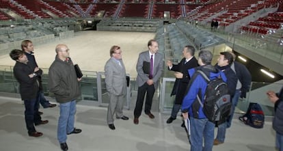 Representantes de la Federación Española en la Caja Mágica.