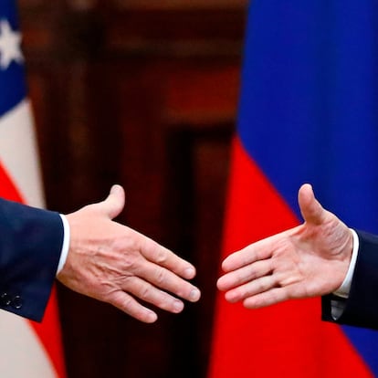 FILE - U.S. President Donald Trump shakes hand with Russian President Vladimir Putin at the end of the press conference after their meeting at the Presidential Palace in Helsinki, Finland, July 16, 2018. (AP Photo/Alexander Zemlianichenko, File)