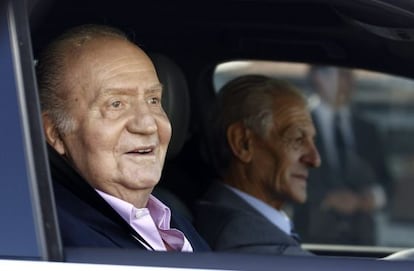 King Juan Carlos smiles as he is driven from Hospital Quir&oacute;n on Tuesday.