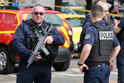 French police secure the area after a teacher was killed and several people injured in a knife attack at the Lycee Gambetta-Carnot high school in Arras, northern France, October 13, 2023.