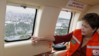 Dilma Rousseff surveys flooded areas of Brazil by helicopter on Christmas Eve.