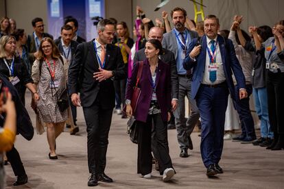 Kai Mykkanen (L), Finland's Minister of the Environment and Climate Change, and Sweden's Minister for Climate Romina Pourmokhtari (R) arrive for continuing negotiations during the COP28 in Dubai, December 11, 2023.