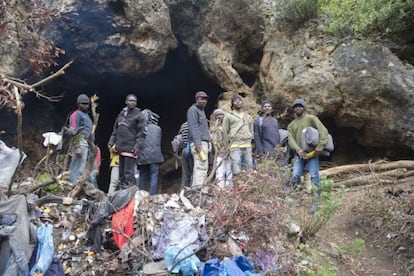 A group of immigrants in their makeshift home in a forest outsideTangier.